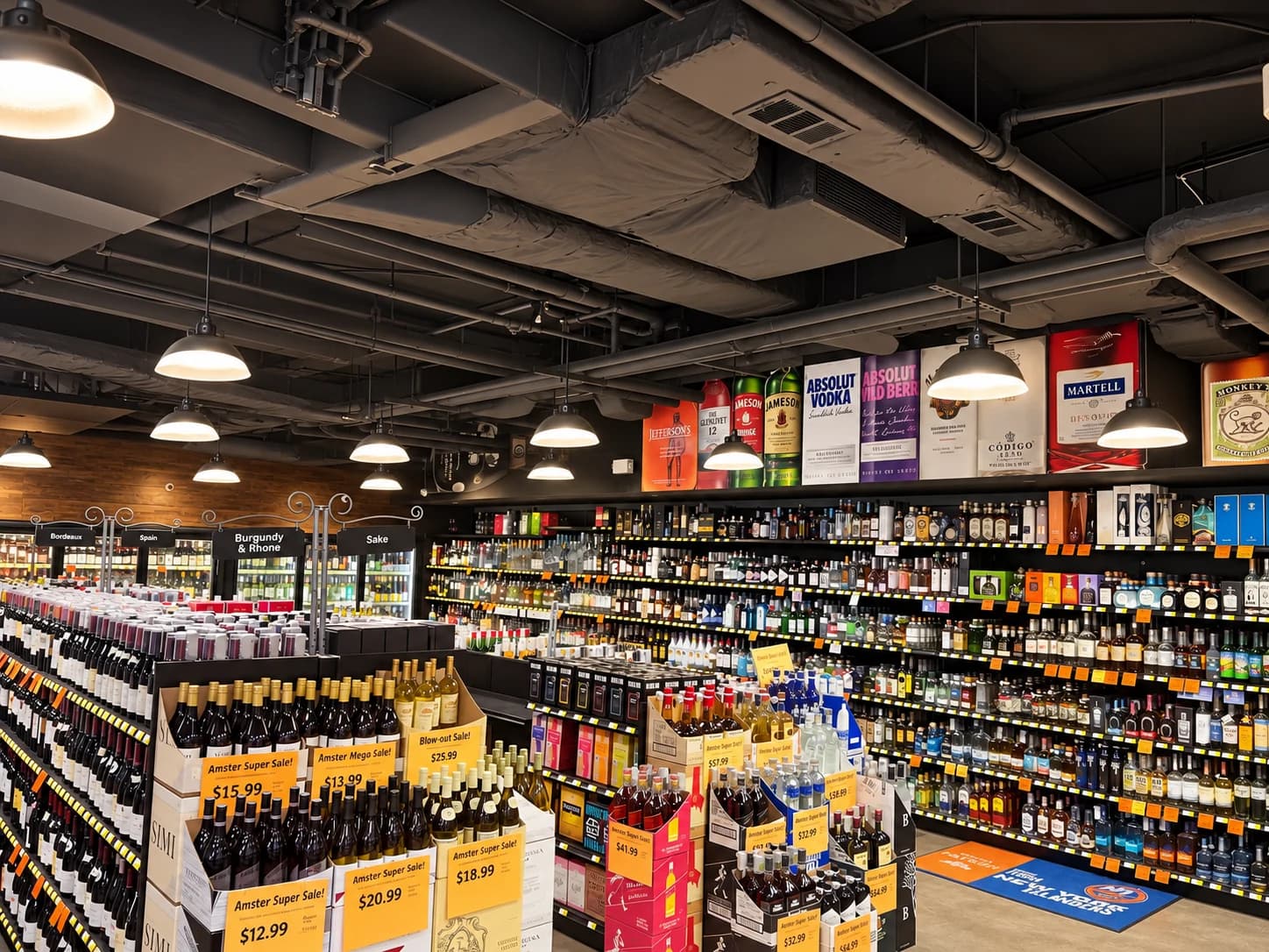 Wine displays and sale placards in front of the store’s extensive spirits shelves.